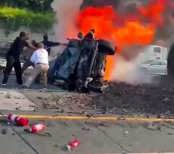 RESCUE ENGINE 33 EXTRICATES ONE FROM BURNING CAR
